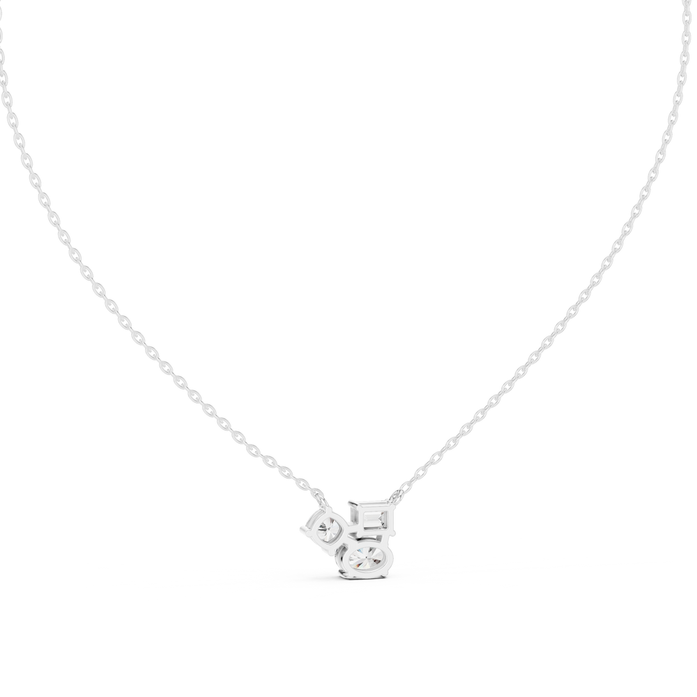 Multi shape cluster diamond pendant necklace with emerald, round and cushion cut stones