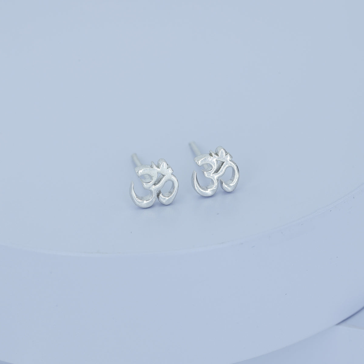 Om symbol stud earrings with polished sacred spiritual motif and flat back