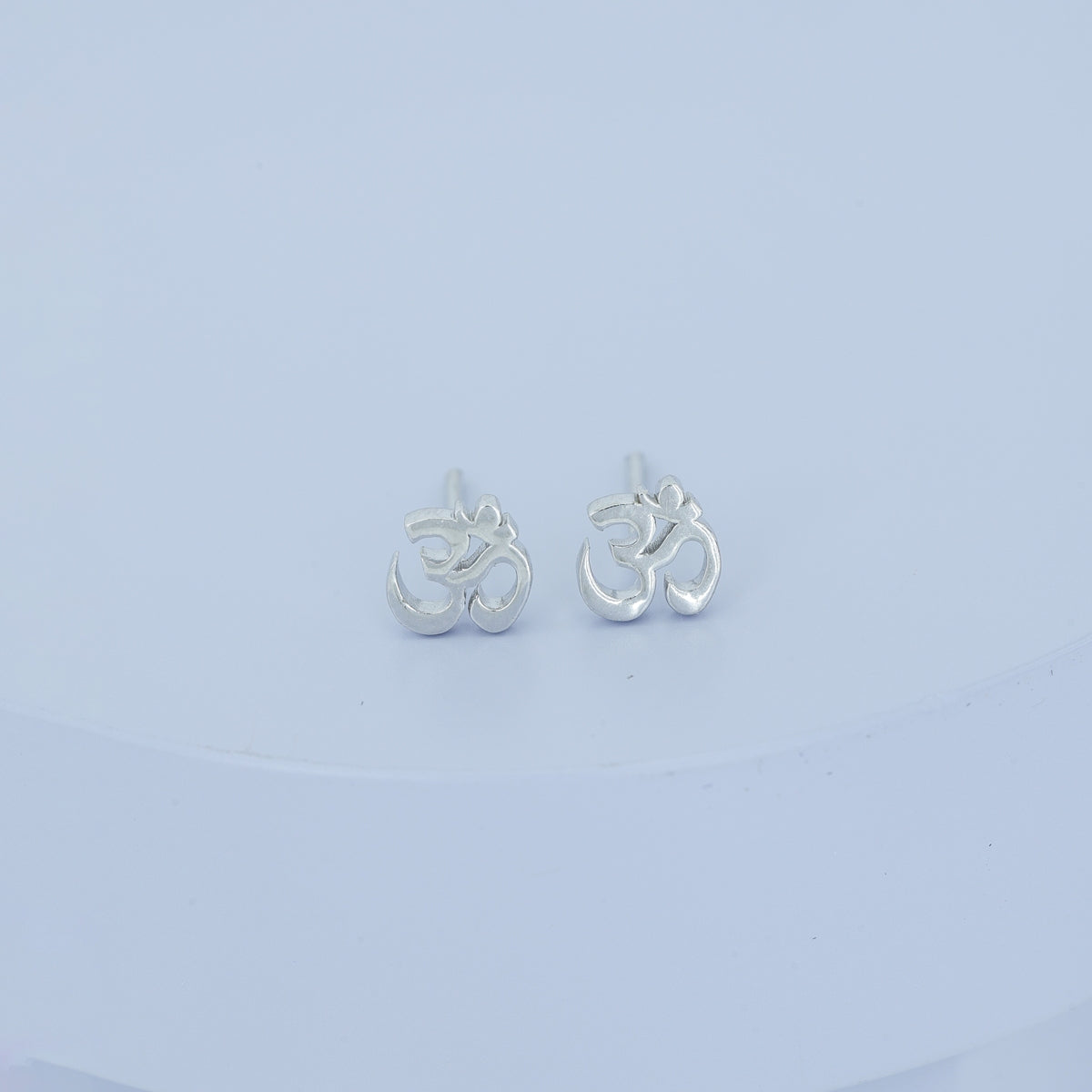 Om symbol stud earrings with polished sacred spiritual motif and flat back