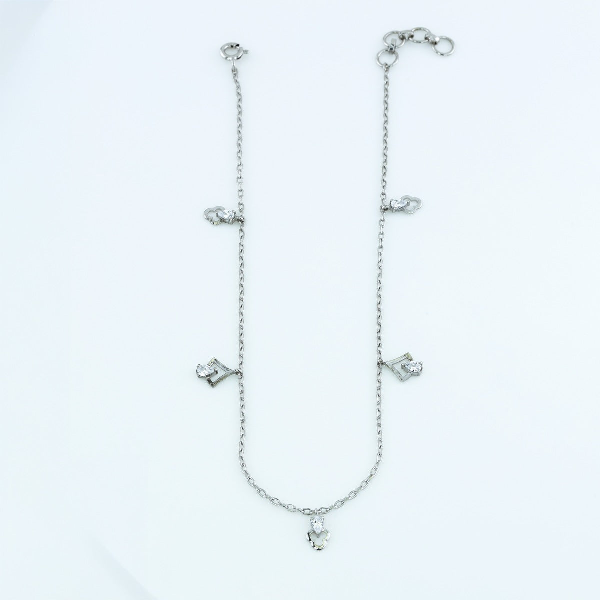 Pear and arrow charm anklet with delicate chain and alternating pear drop and arrow shaped charms
