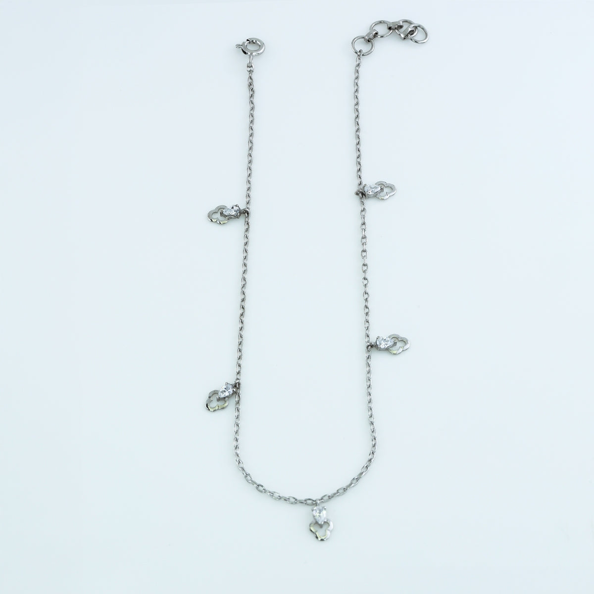 Pear drop charm anklet with delicate chain and five dangling pear shaped stone charms