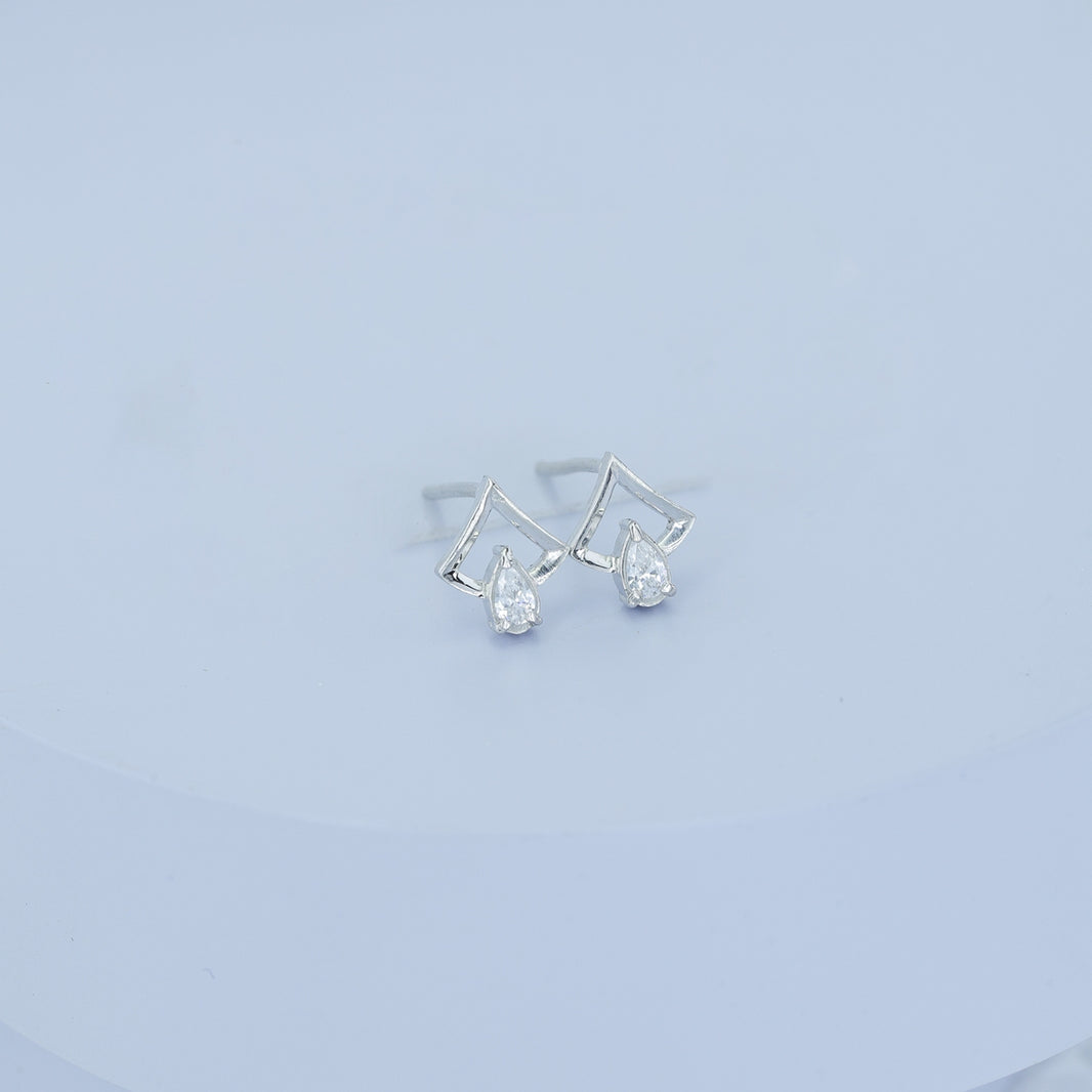 Pear drop chevron frame stud earrings with open angular top and raised stone base