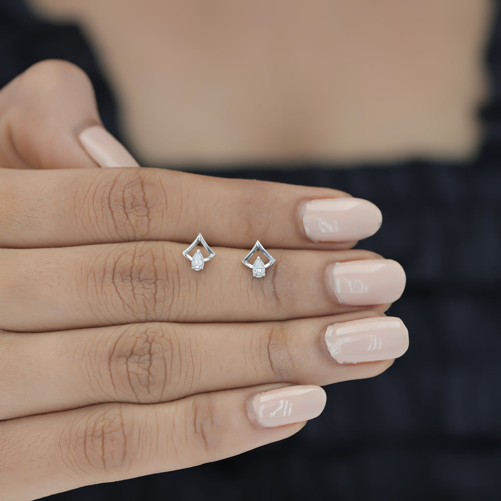 Pear drop chevron frame stud earrings with open angular top and raised stone base