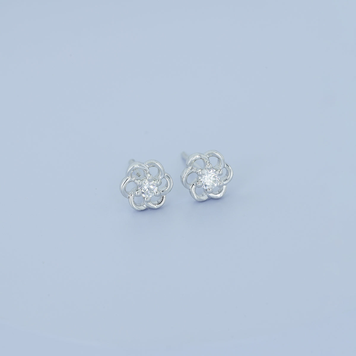 Phool baali stud earrings with five-petal floral frame and round centre stone