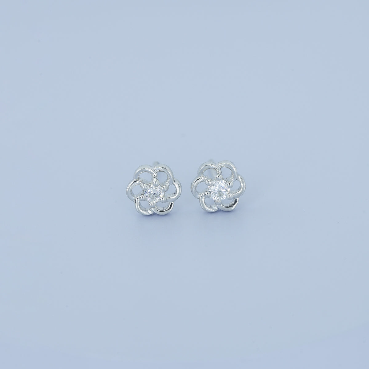 Phool baali stud earrings with five-petal floral frame and round centre stone