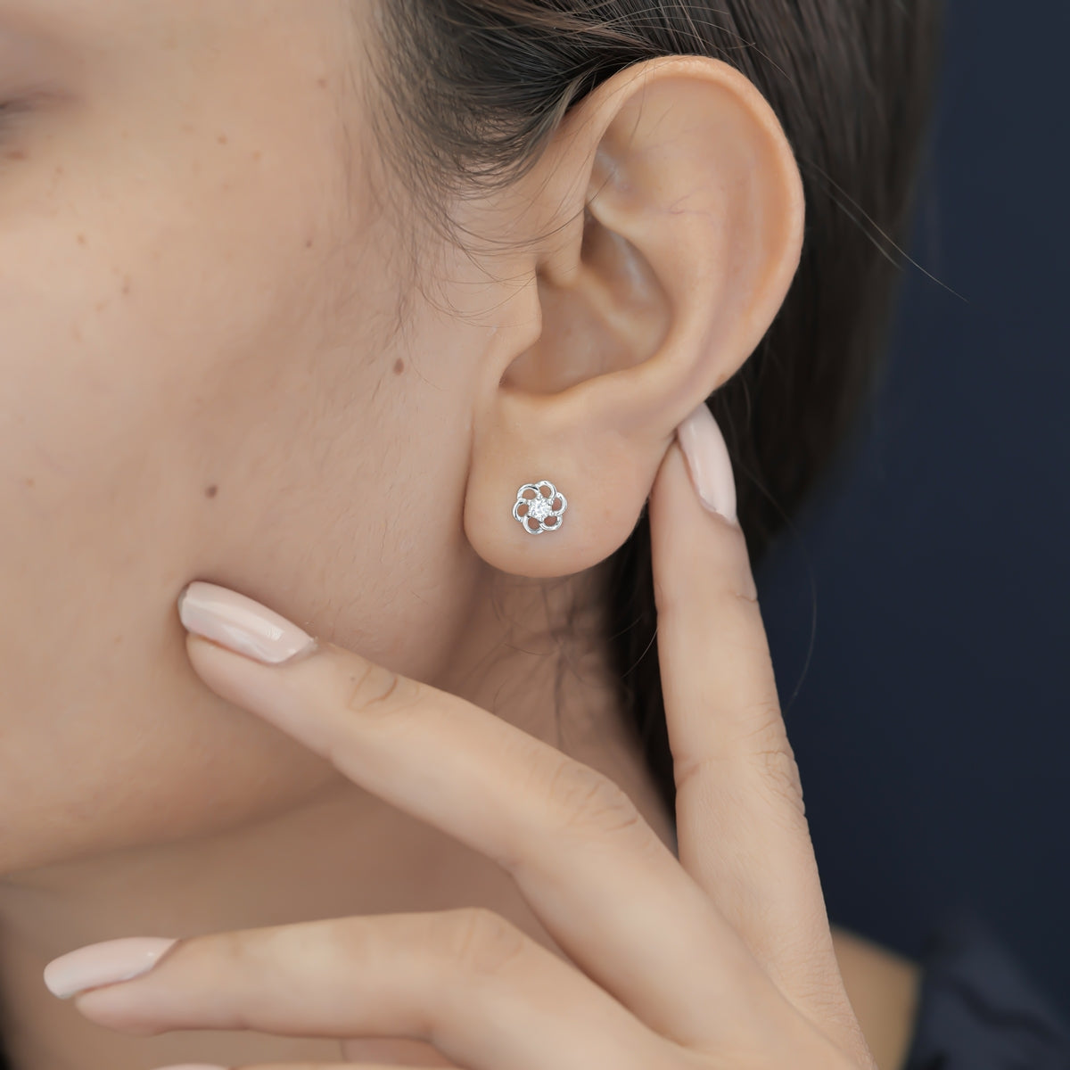 Phool baali stud earrings with five-petal floral frame and round centre stone