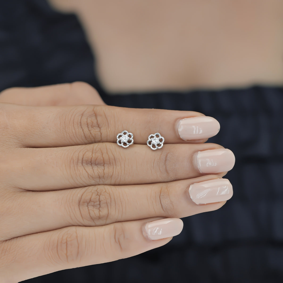 Phool baali stud earrings with five-petal floral frame and round centre stone