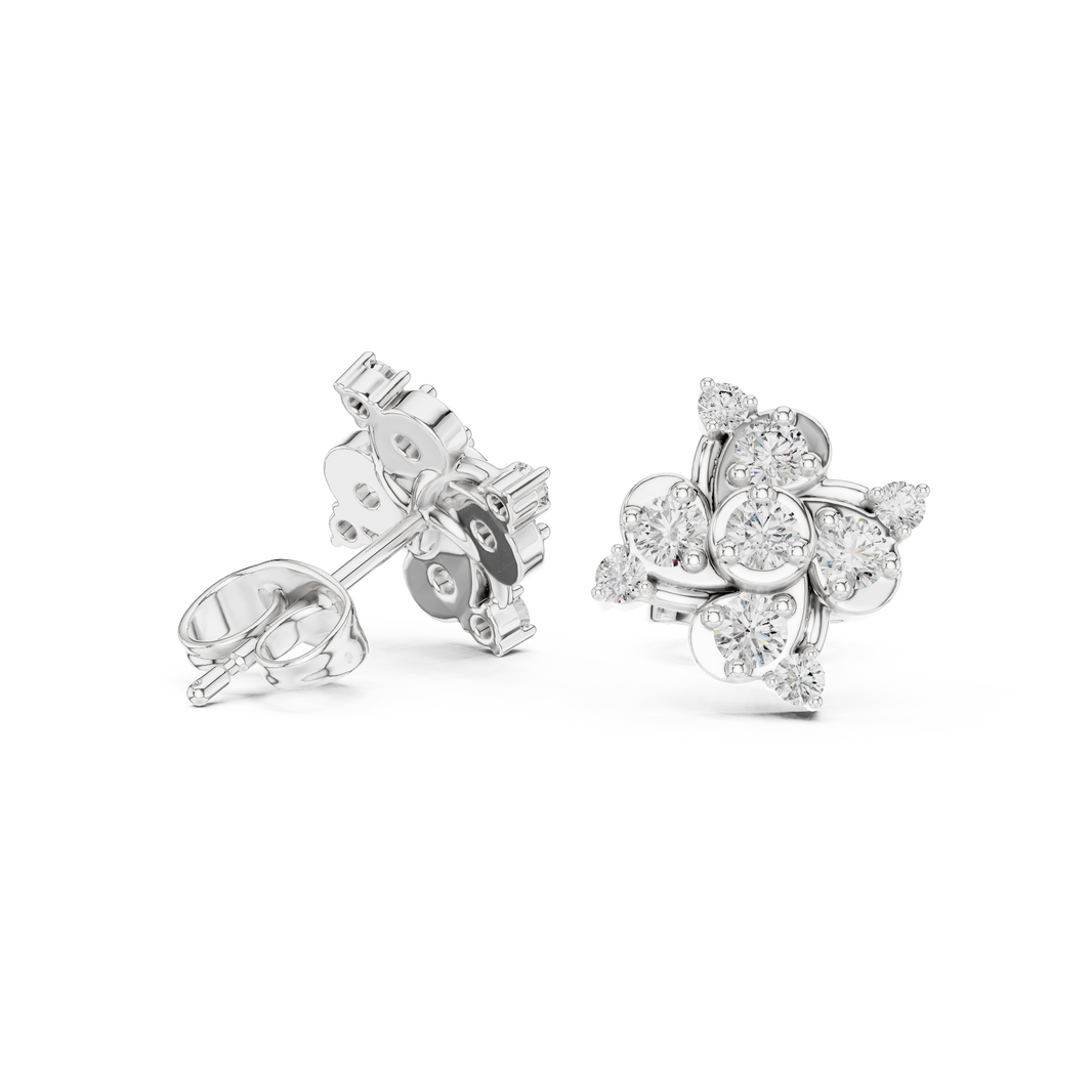Pinwheel floral cluster stud earrings with three bezel set round stones in swirling pinwheel arrangement with pear stone accents