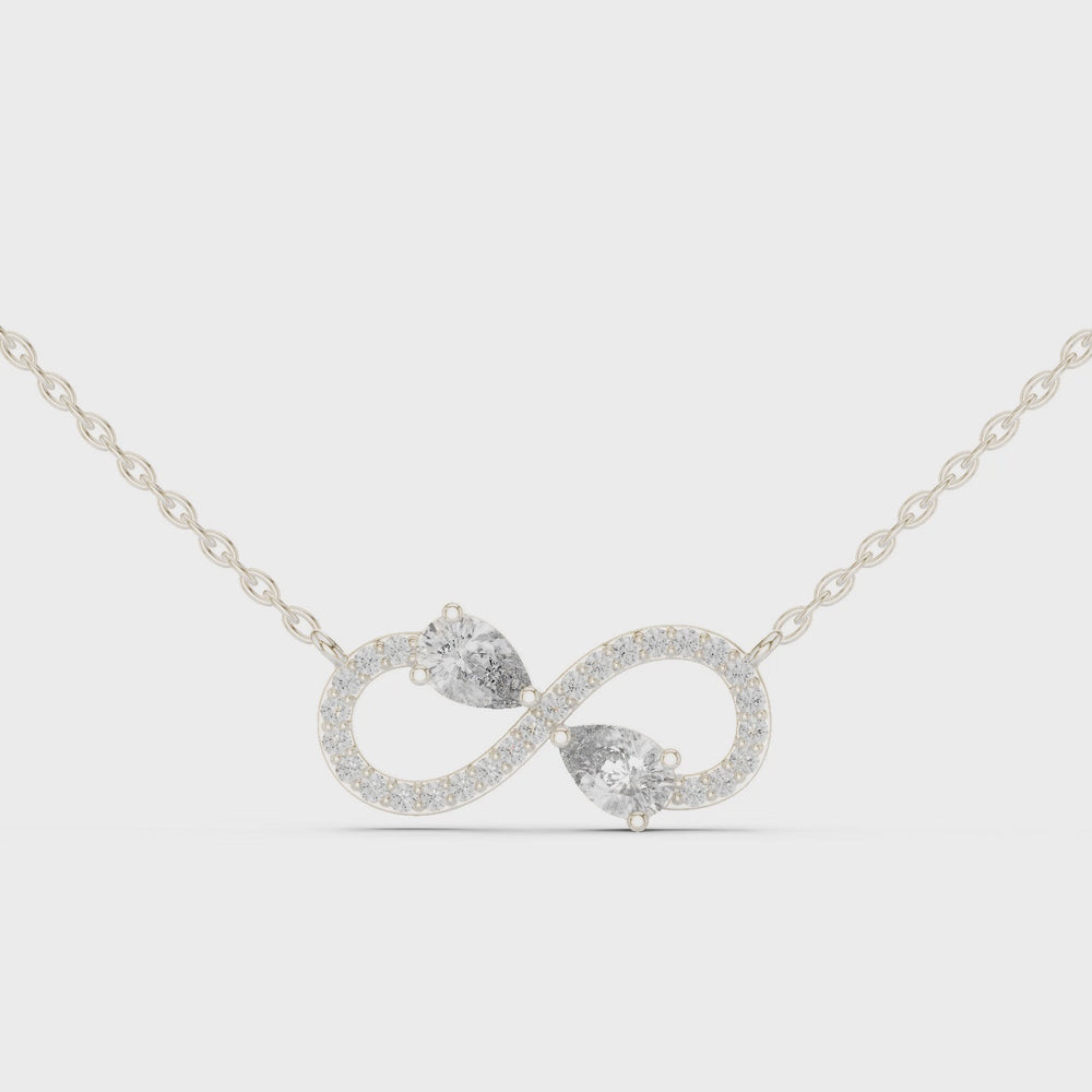 Infinity symbol pave diamond pendant necklace with dual pear cut stone accent