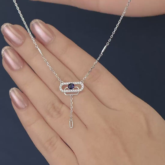 Delicate necklace featuring a pavé oval frame centered with a dark crystal drop