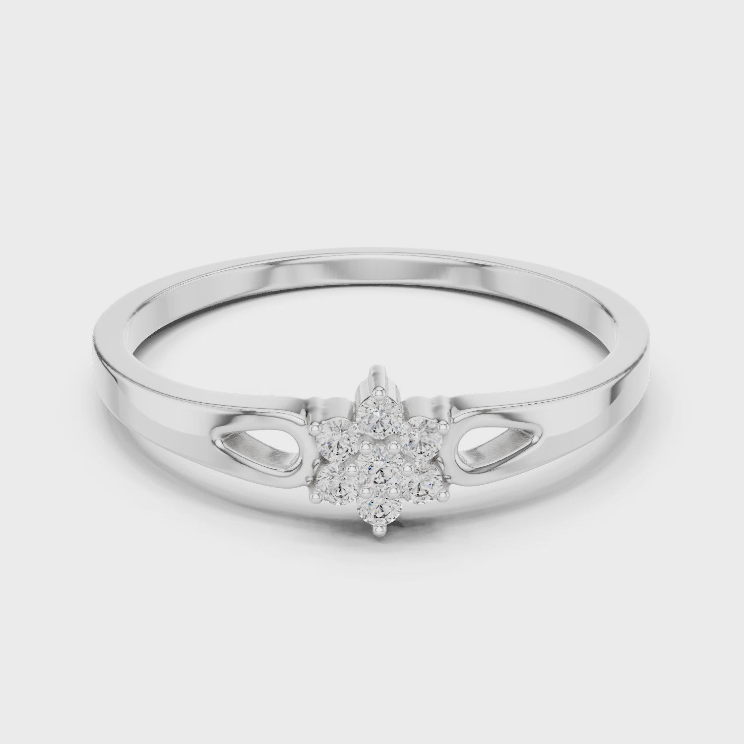 Floral cluster ring with teardrop cutout shoulders and polished flat band
