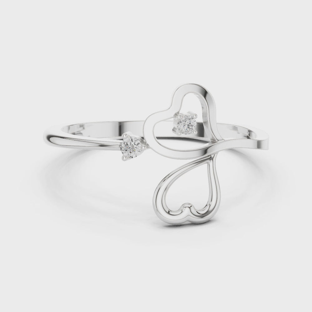 Triple heart open bypass ring with interlinked outline hearts and solitaire accents
