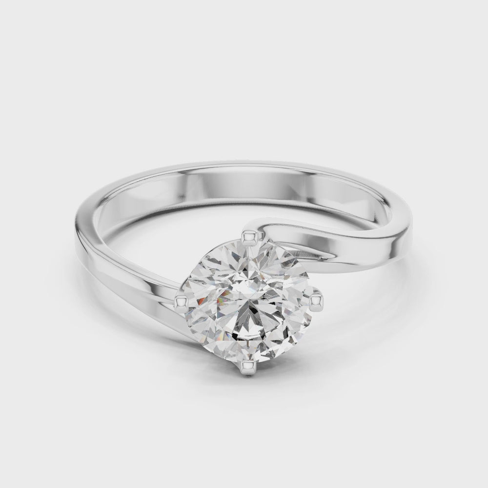 Bypass twist solitaire diamond engagement ring with round brilliant cut stone