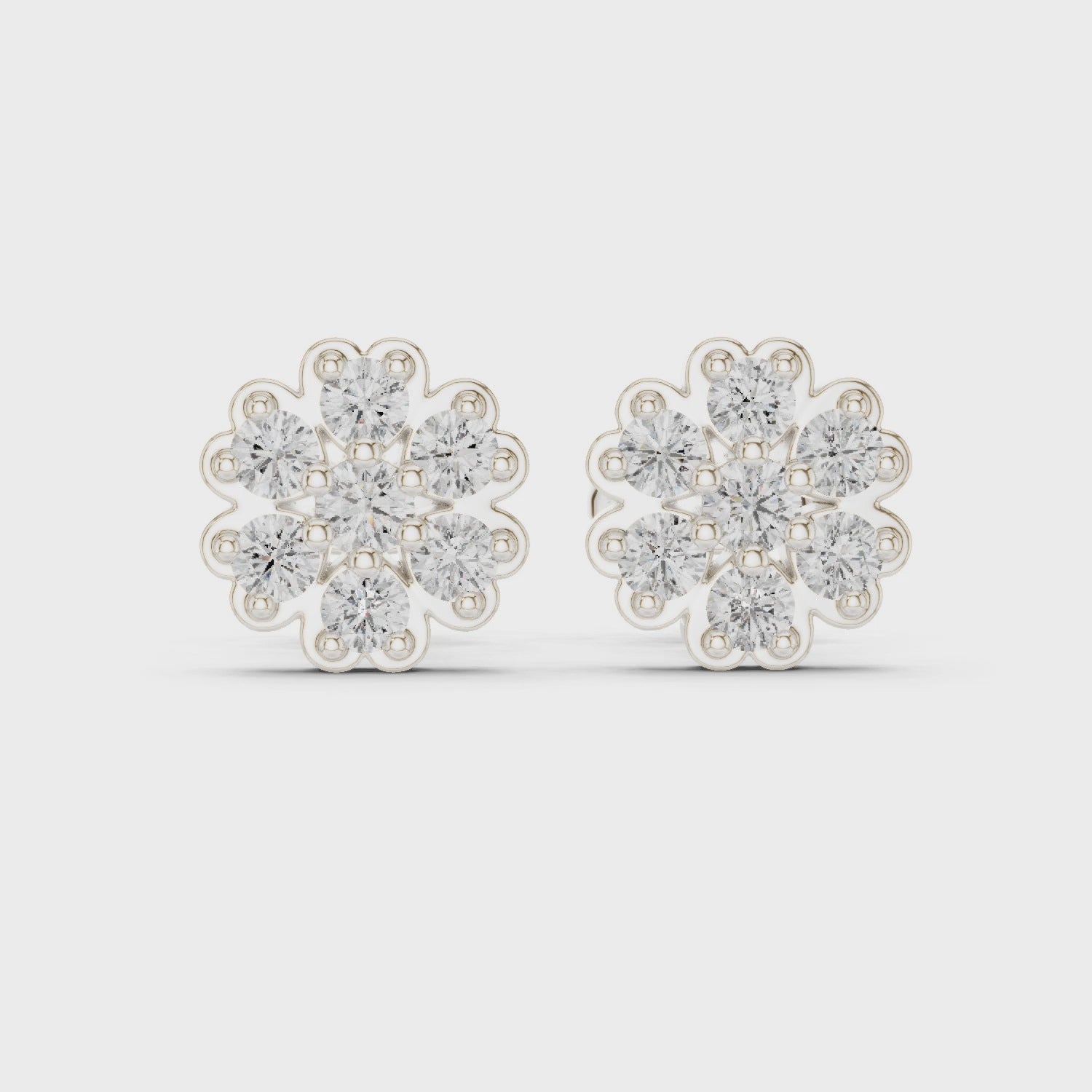 Snowflake cluster stud earrings with scalloped edge and sparkling stone detailing