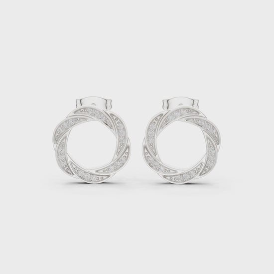 Twisted hoop pave diamond earrings with intertwined design and push back setting