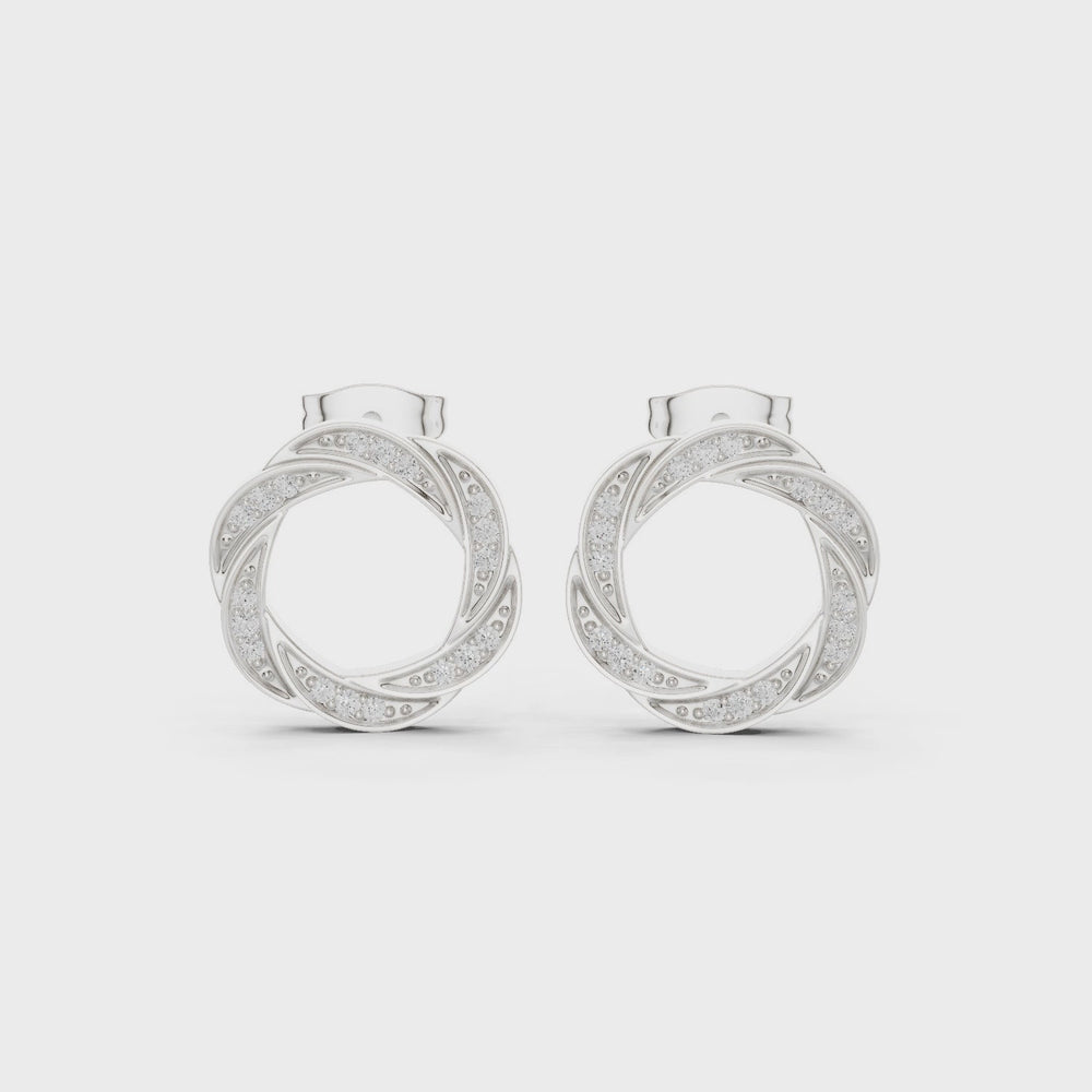 Twisted hoop pave diamond earrings with intertwined design and push back setting
