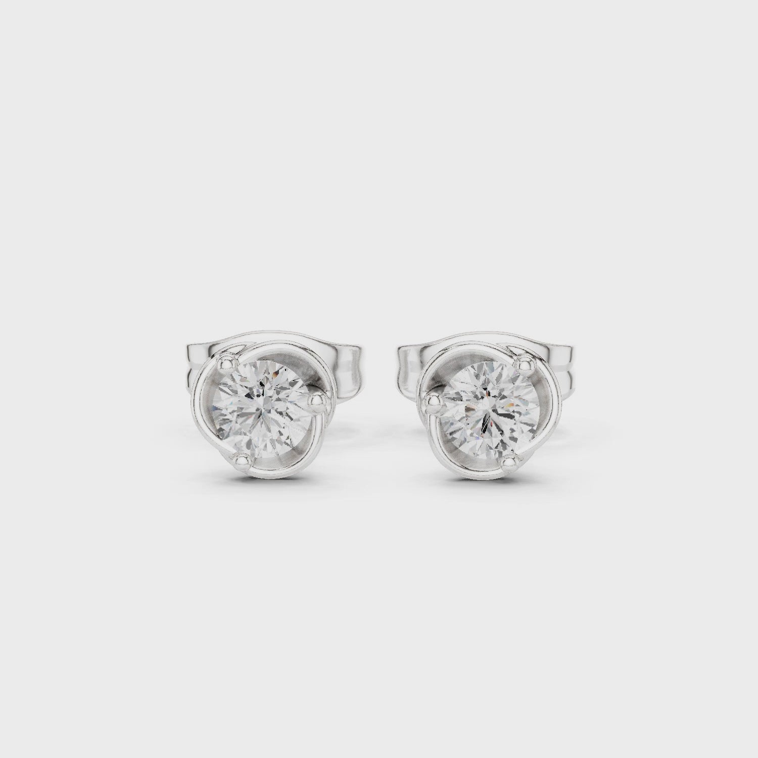 Elegant round solitaire stud earrings with classic bezel setting