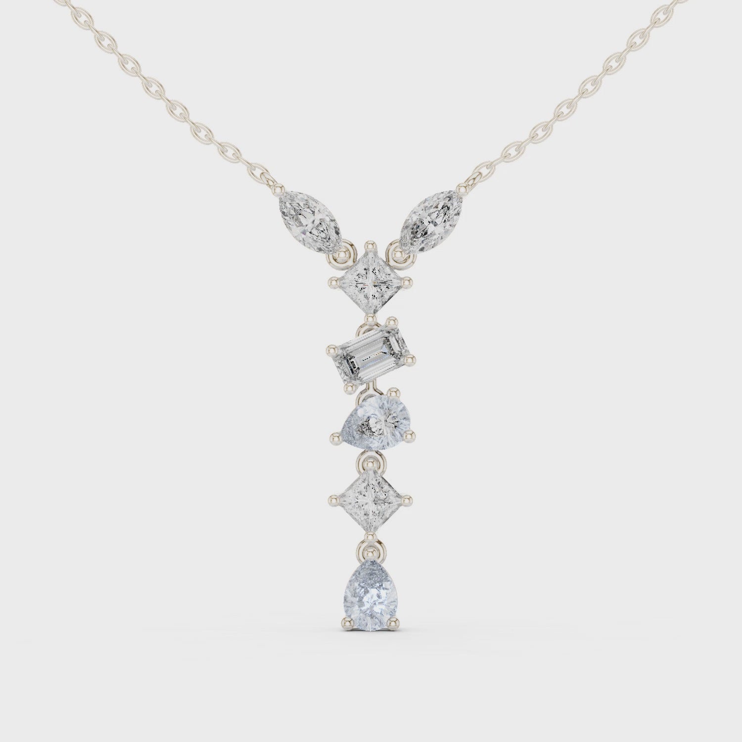 Multi shape journey diamond drop necklace with marquise, emerald, cushion and pear cut stones