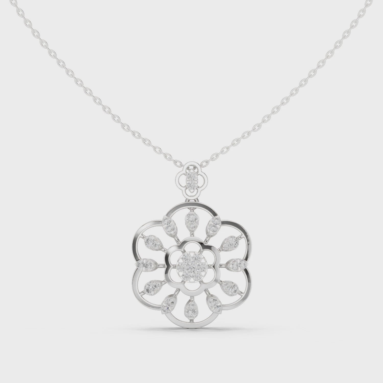 Silver chain necklace with open floral mandala pendant featuring diamond cluster center and pear-cut accents
