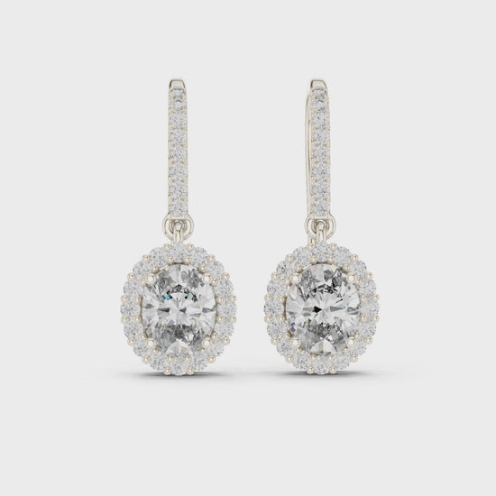 Halo solitaire hook drop earrings with pave set stone detailing