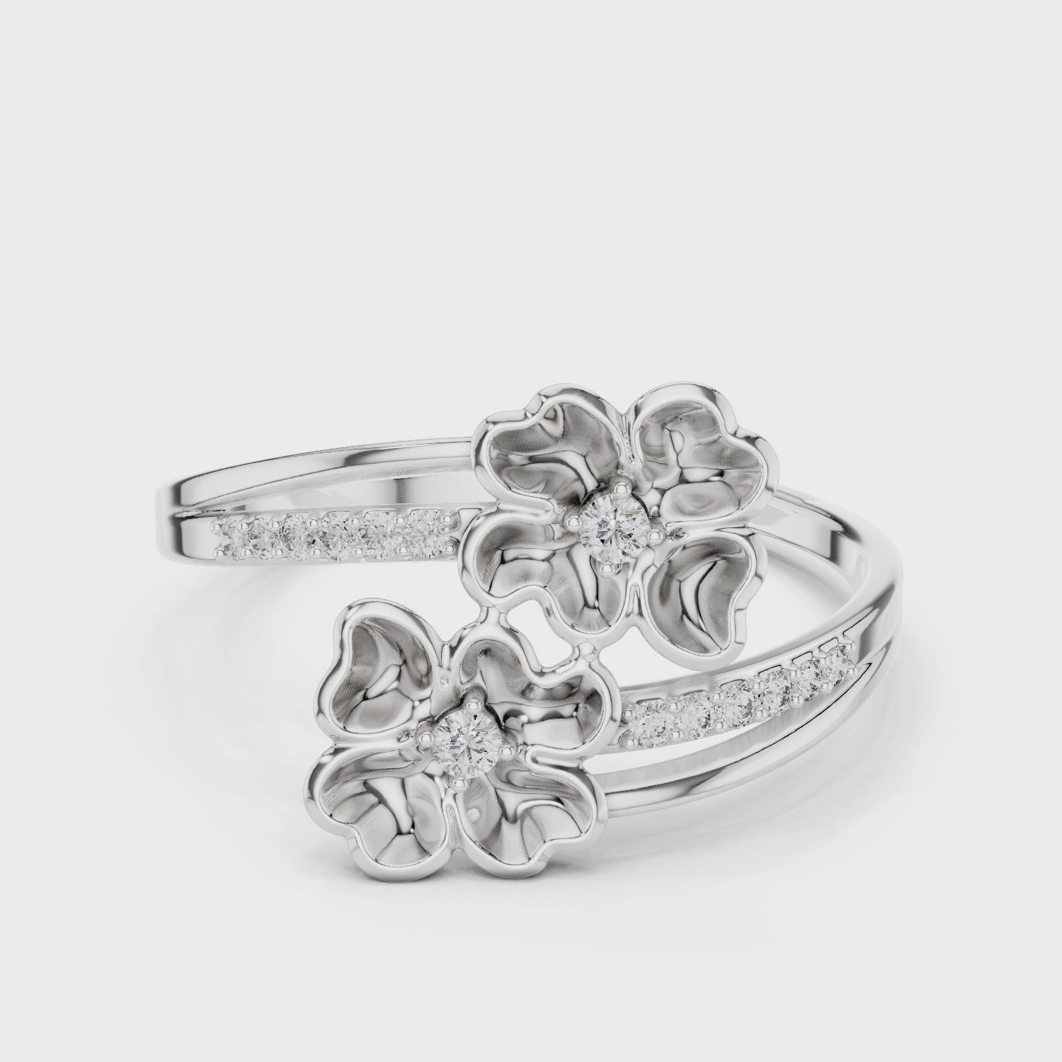 Double blossom bypass ring with sculpted petals and channel set band
