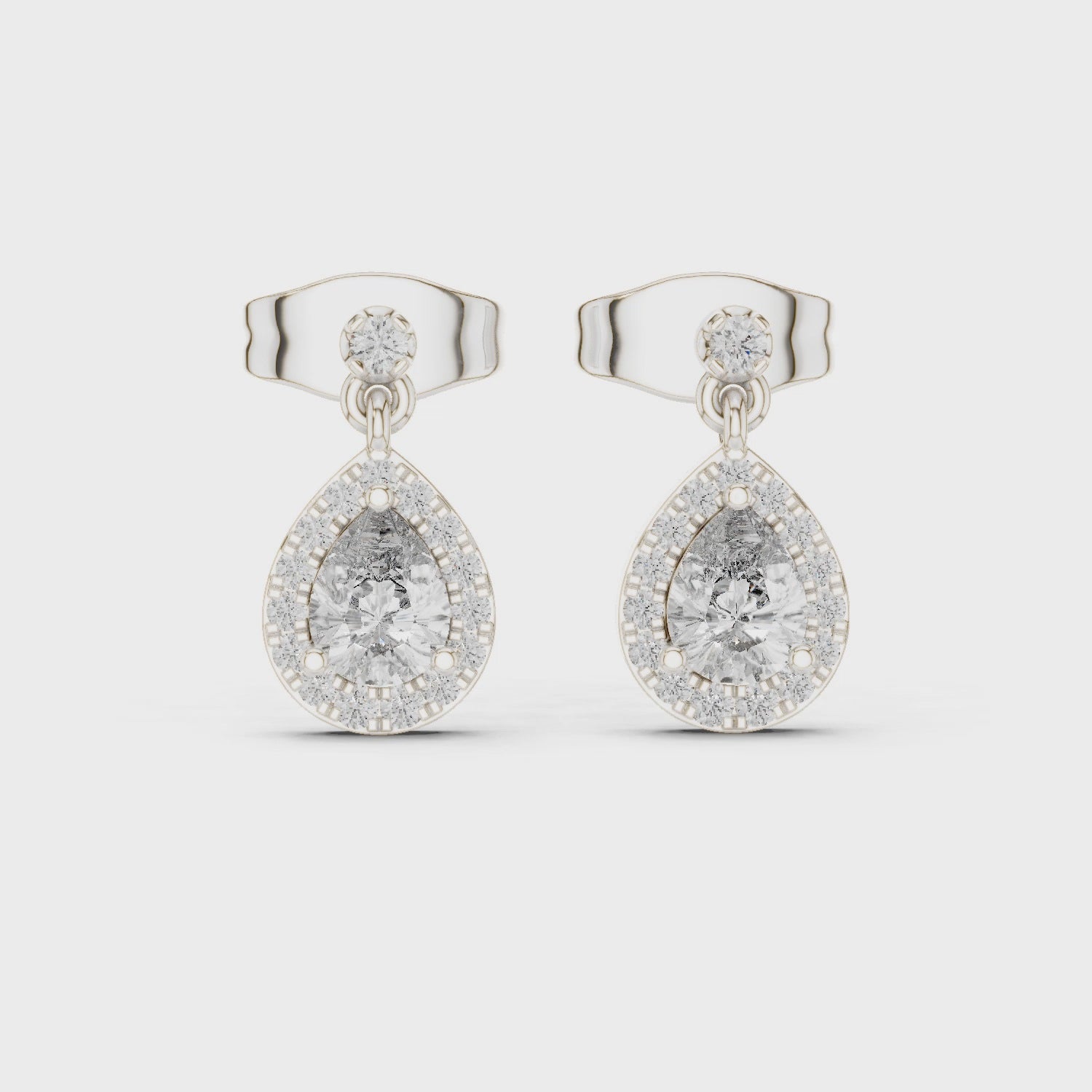 Pear shaped halo dangle stud earrings with pave set cluster detailing
