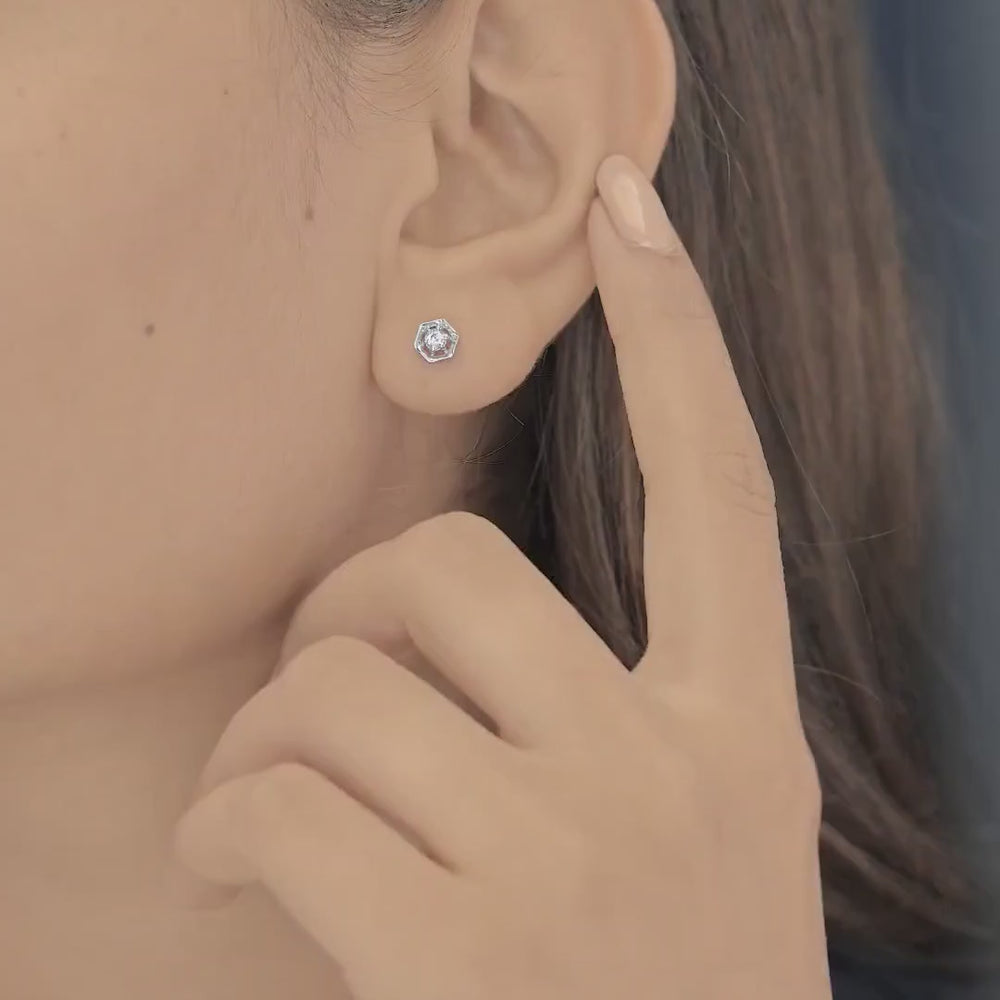 Hexagon stud earrings with geometric frame and raised round centre