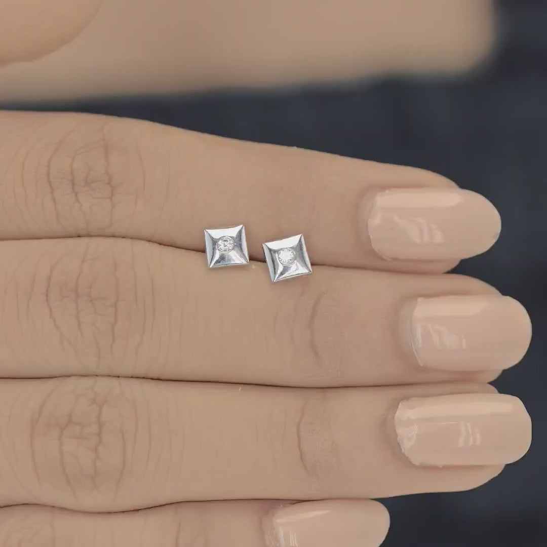 Chaukor stud earrings with diamond-shaped geometric frame and bezel-set round centre stone