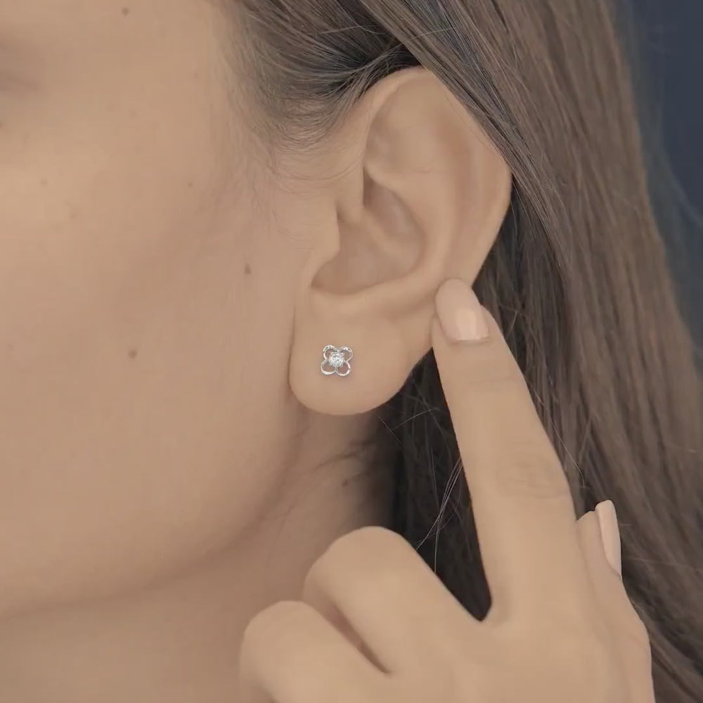 Four petal floral stud earrings with round raised centre and open petal frame