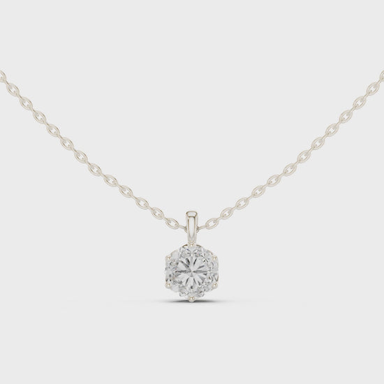 Round brilliant solitaire diamond pendant necklace with filigree basket setting