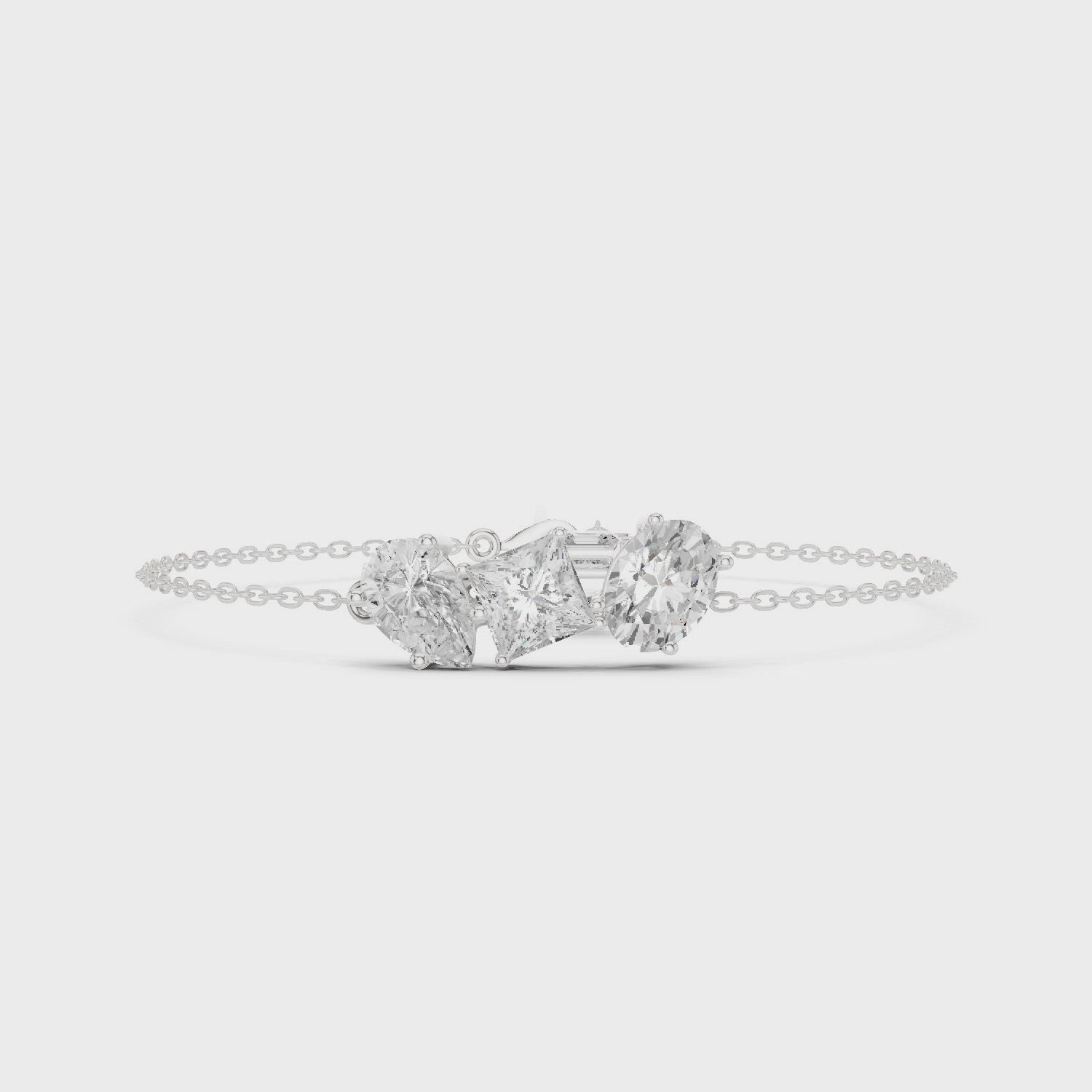 Silver chain bracelet with three mixed-cut diamond stones centerpiece