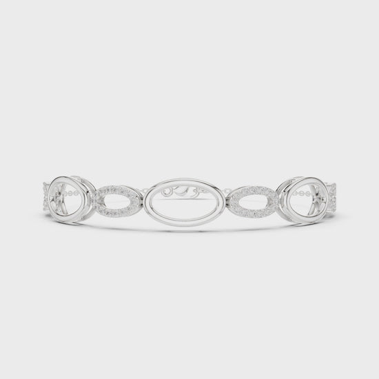 Oval link chain bracelet with open and pave set stone detailing