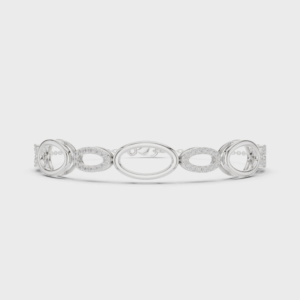 Oval link chain bracelet with open and pave set stone detailing