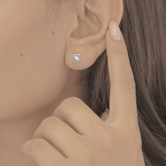 Marquise stud earrings with tilted square open frame border