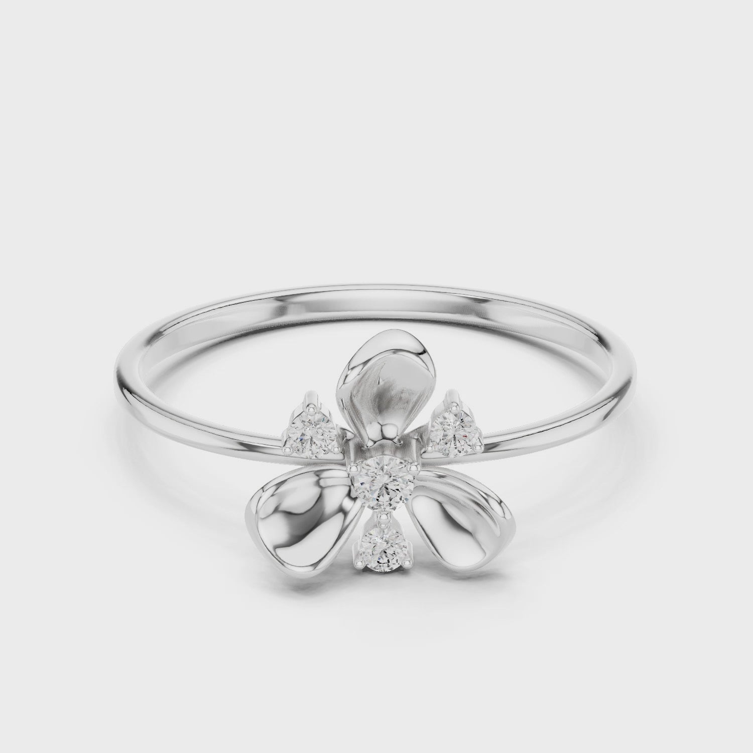 Bow cluster delicate ring with sparkling stones and dainty thin band