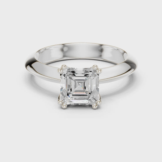 Asscher cut solitaire engagement ring with eight prong basket setting and wide polished band