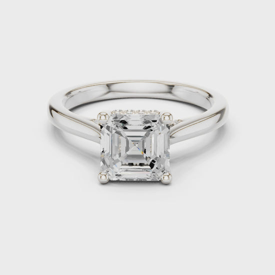 Asscher cut solitaire engagement ring with hidden halo and sleek polished band