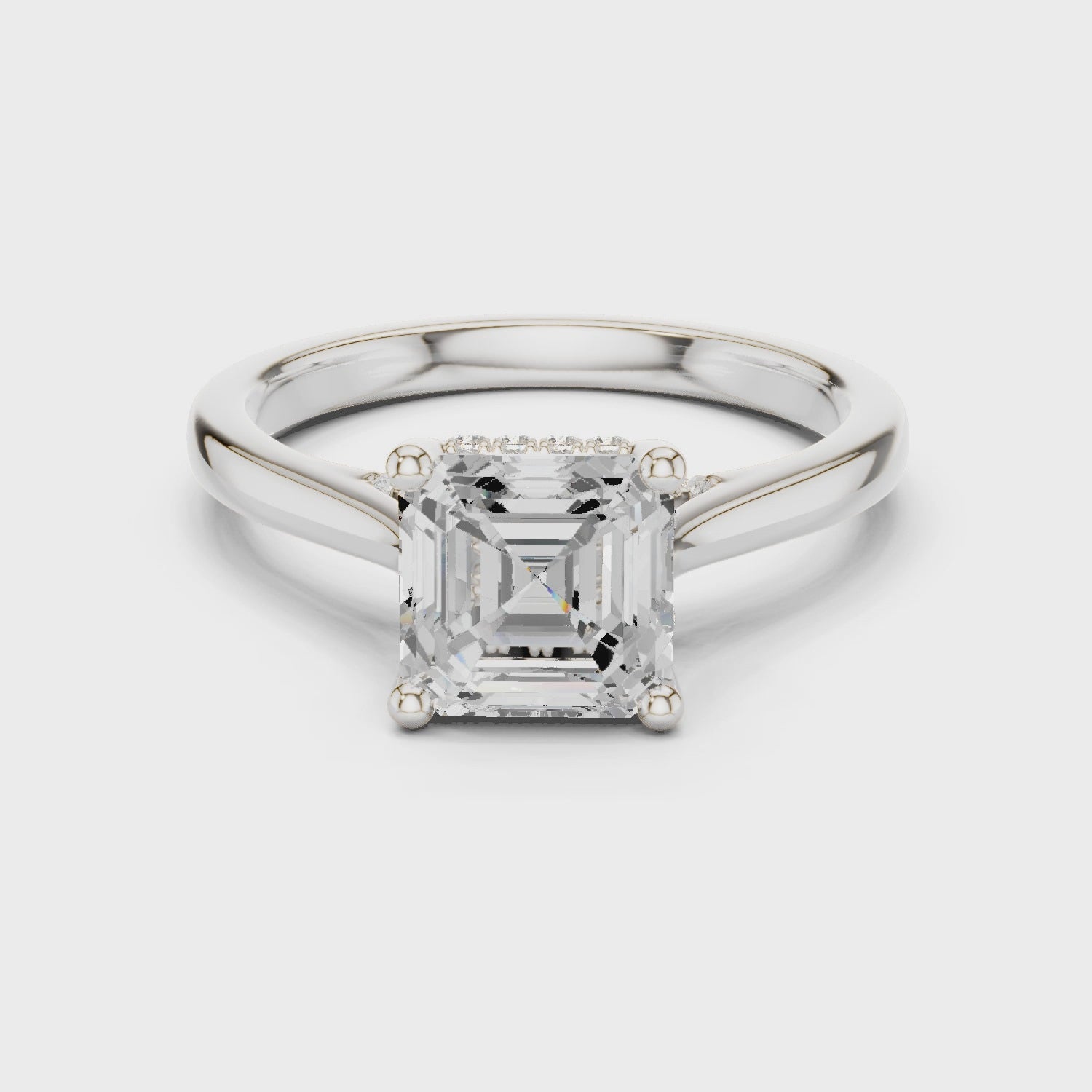 Asscher cut solitaire engagement ring with hidden halo and sleek polished band