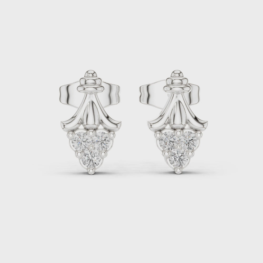 Crown shaped stud earrings with intricate detailing and sparkling stones