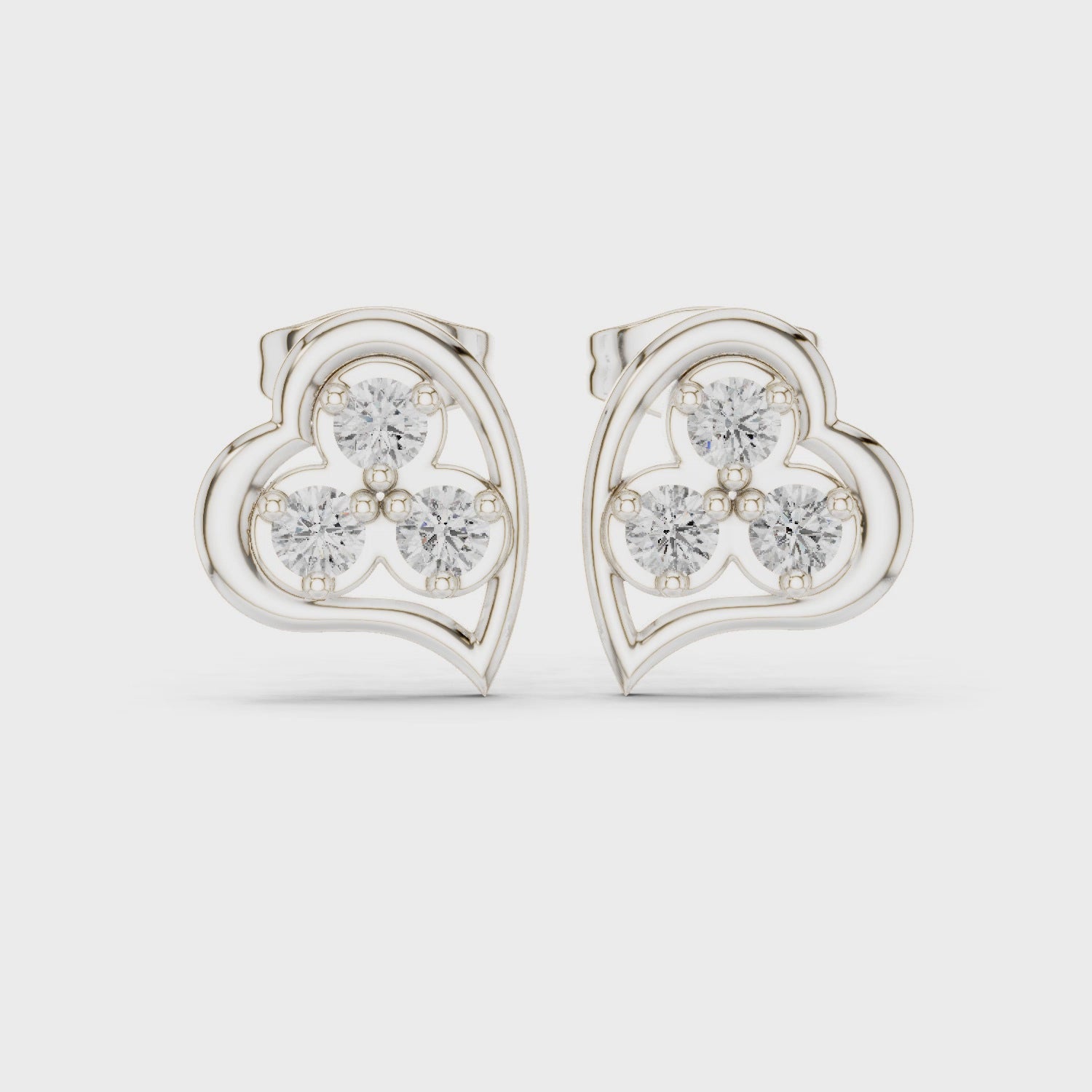 Heart shaped trio stud earrings with sparkling stone detailing