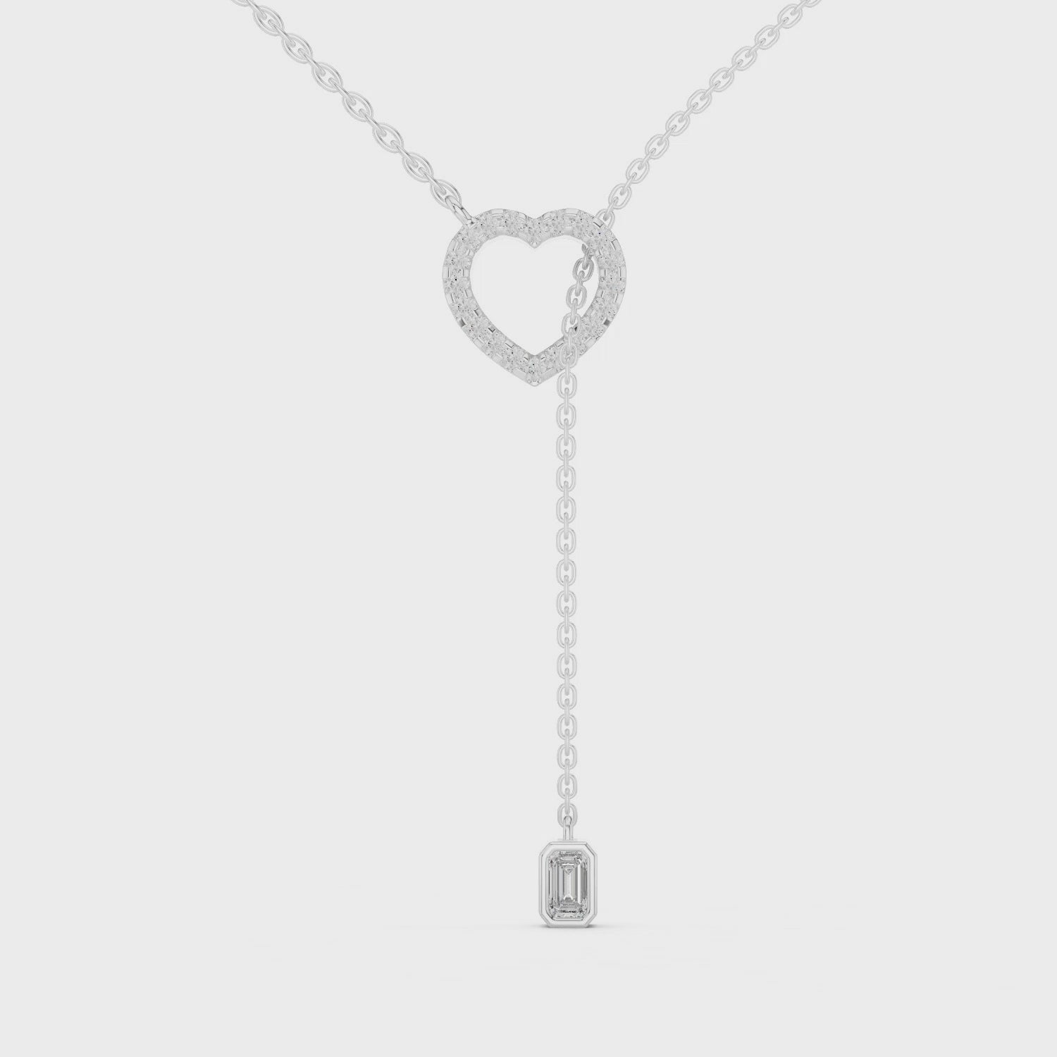 Pave heart lariat diamond necklace with emerald cut solitaire drop pendant