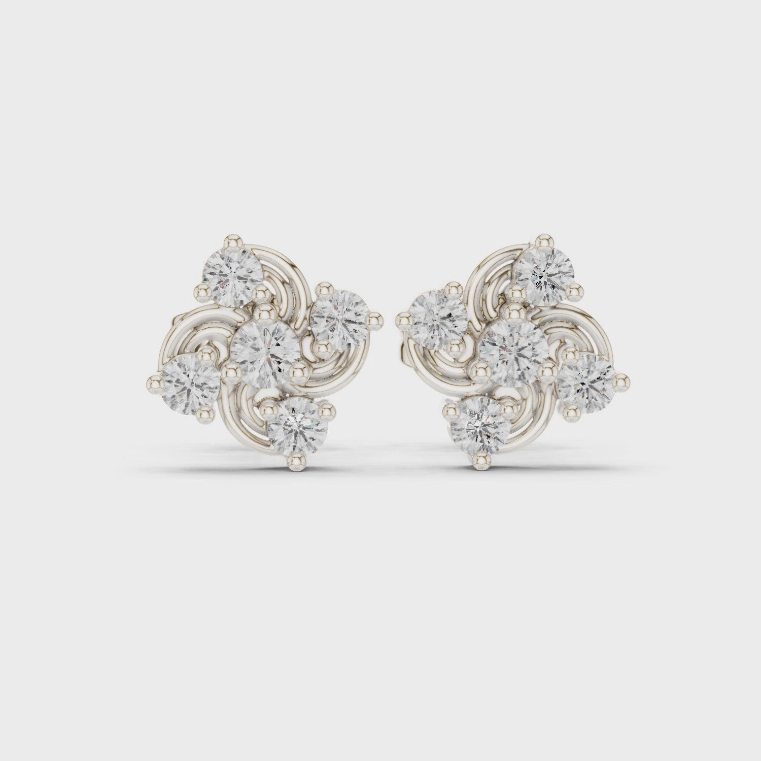 Trefoil stud earrings with swirl and sparkling stone detailing