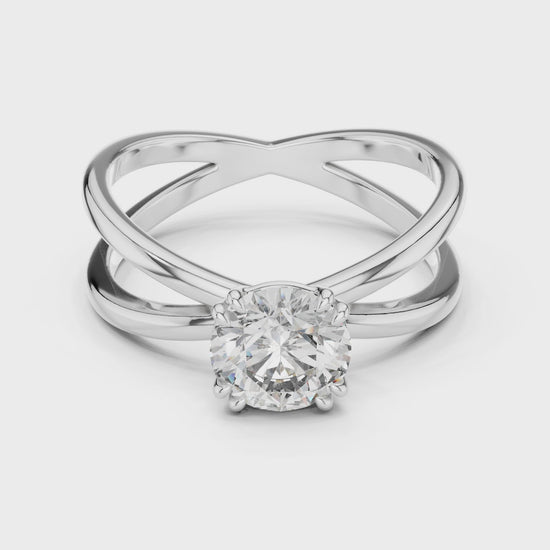 Criss cross split shank solitaire diamond engagement ring with round brilliant cut stone
