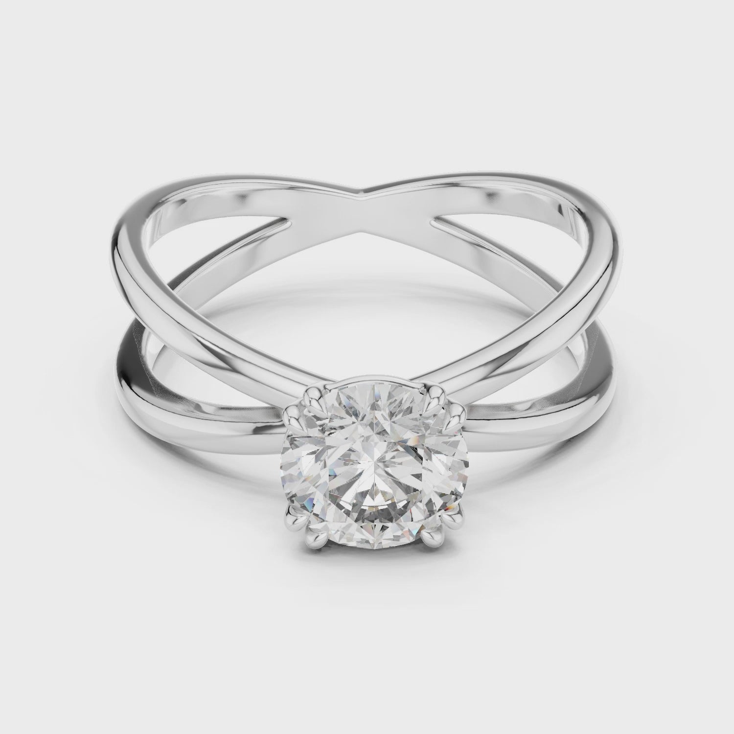 Criss cross split shank solitaire diamond engagement ring with round brilliant cut stone