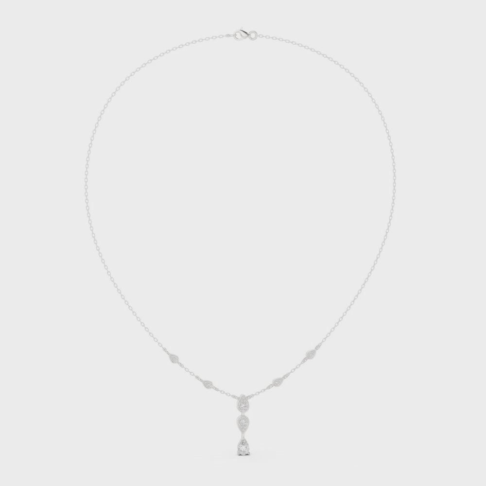 Pear and marquise diamond drop station necklace with bezel set chain accents