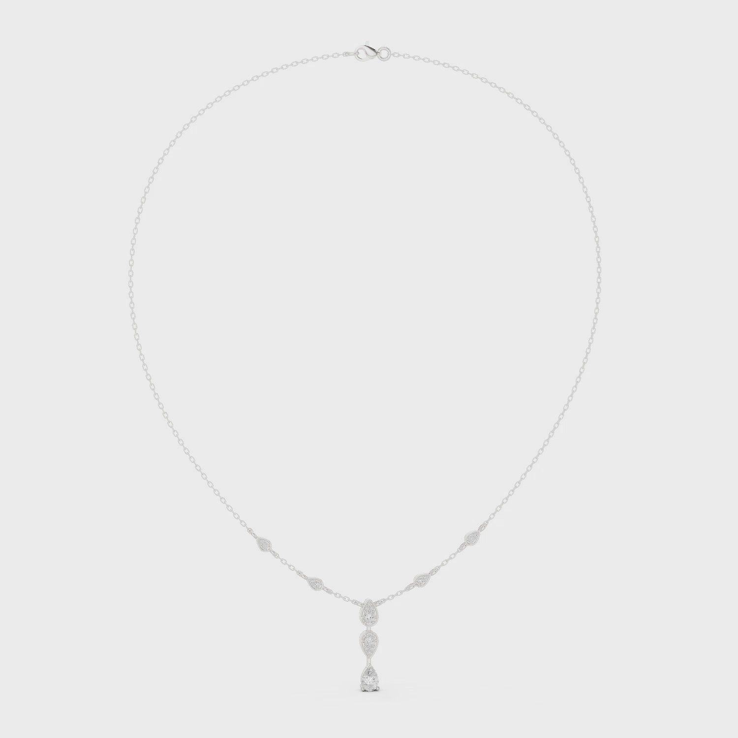 Pear and marquise diamond drop station necklace with bezel set chain accents