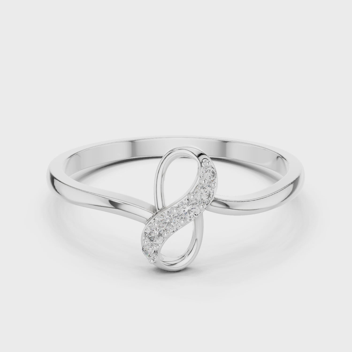 Infinity knot ring with sparkling figure eight top and plain slim band