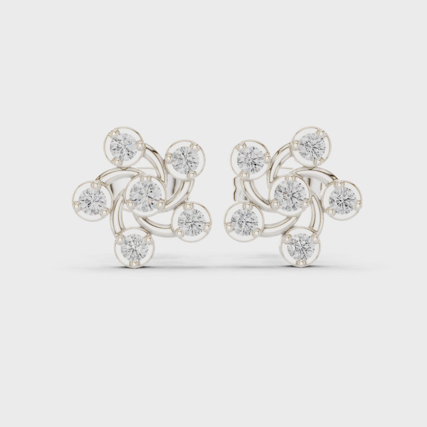 Zigzag cluster stud earrings with bezel set sparkling stones