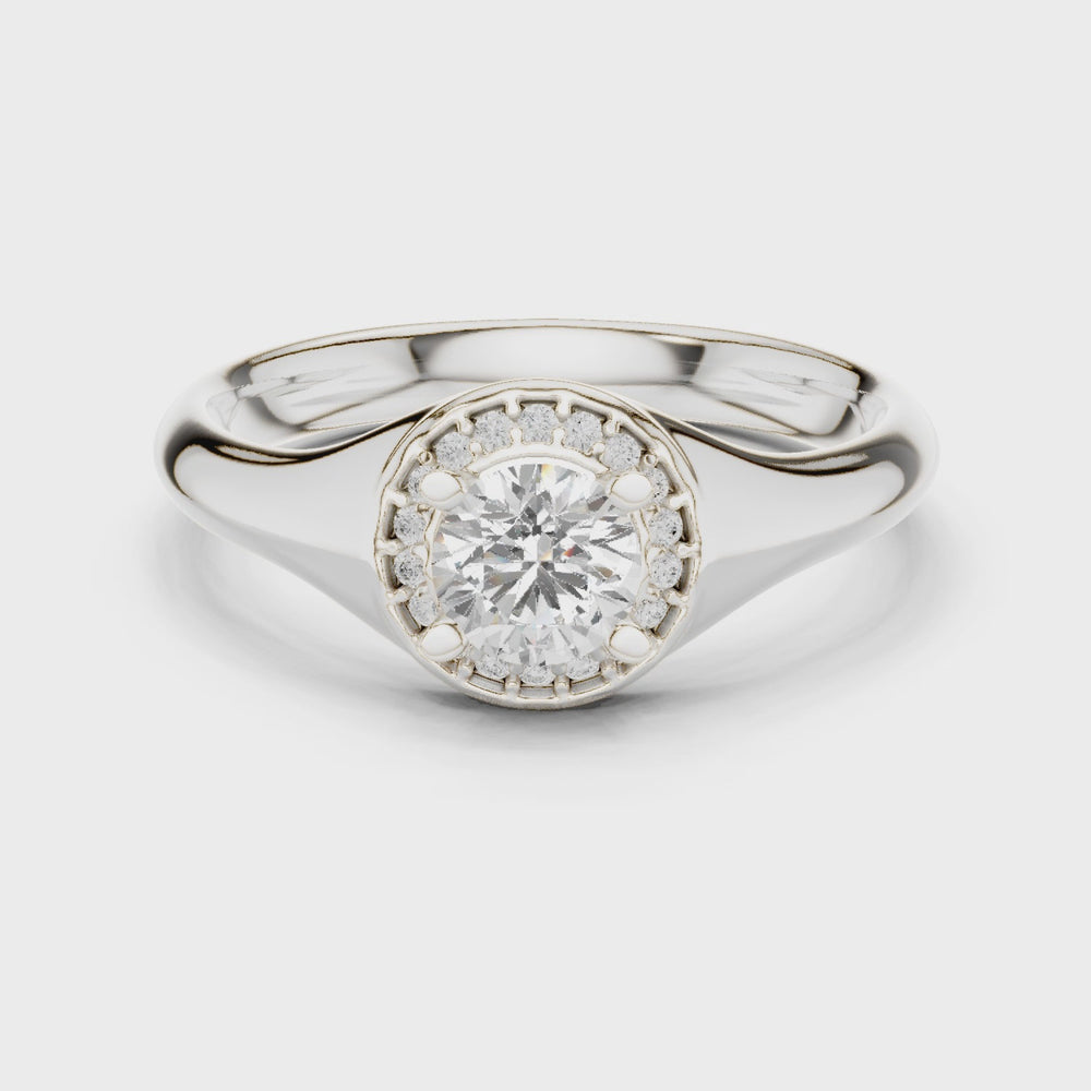 Halo solitaire engagement ring with pave set surround and plain polished band