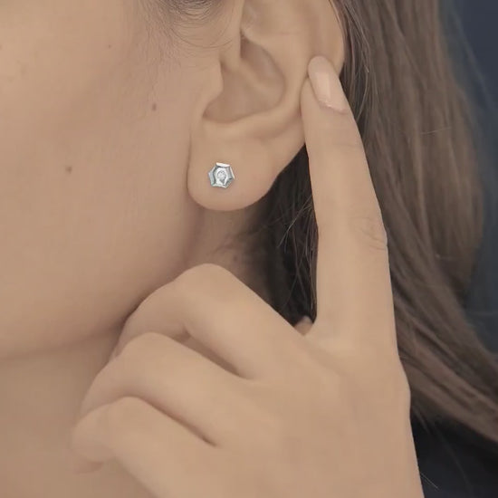 Geometric cube solitaire stud earrings with hexagonal frame and round centre stone